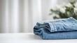 © MakeitEasy - Folding denim jeans home photography indoor close-up fashion and lifestyle trends