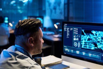 Aufkleber - Focus on mature male officer in uniform sitting by workplace and looking at computer screen with graphic military data
