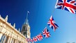 © ManitaSr - Colorful British flags fluttering against a clear blue sky.
