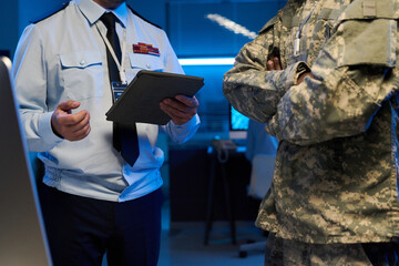 Aufkleber - Two unrecognizable male officers in uniform standing in front of camera during discussion of military information