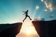 © miss irine - Man jumps between cliffs. Sunrise sky. Strong image for leadership concept. Businessman takes risk. Cloud, sky background. Dramatic scenery. Person in action. Leap of faith. Success concept. Change.