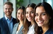© miss irine - Happy business people in group portrait indoors. Business team members look friendly, pro. Success, teamwork highlighted. Seem involved in startup corporate environment. Modern business setting