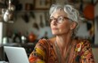 © yevgeniya131988 - Senior woman working from home, thoughtful at kitchen desk