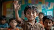© Aisha - A boy proudly raising his hand during a lesson, with colorful posters and blurred classmates visible behind