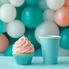 Wall Mural - Delightful cupcake with pink frosting beside a takeout coffee cup and colorful balloons in the background