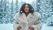 © ЮРИЙ ПОЗДНИКОВ - Beautiful black woman wearing fur coat enjoying winter snowfall in snowy forest