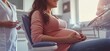 © EFA - Pregnant woman sitting in a dental chair during a check-up.
