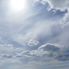 Wall Mural - sun on beautiful blue sky with white clouds.