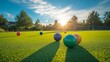 © VIK - A close-up image of lawn bowls with colorful designs on a green outdoor bowling green, shining in the bright sunlight.