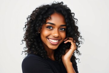 Wall Mural - Portrait of a Smiling Young Woman with Beautiful Curly Hair Against a Neutral Background