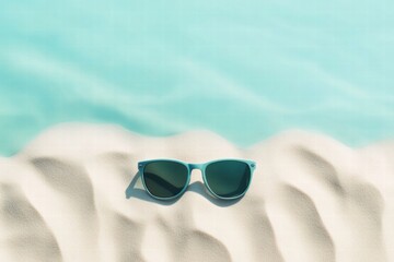 Aufkleber - Stylish sunglasses resting on soft sand with clear blue water in the background inviting a relaxing beach day. Generative AI