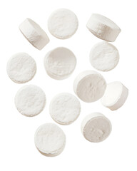 White round tablets in mid air isolated on transparent background