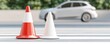 © Nattapol - Urban traffic cones guiding vehicles with blurred background