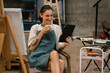 © NINENII - lifestyle of worker home studio. Creative painter painting in an art studio.