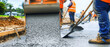 © Wonderful Studio - Concrete construction. Construction workers pouring concrete on a construction site.