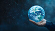 © Iryna - Woman hand holding a glowing planet in the vastness of space during a serene cosmic moment. Galaxy background with copy space.
