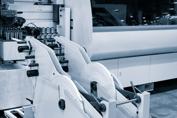 Poster - Wood boards on a woodworking machine in a modern furniture factory, woodworking industrial concept background