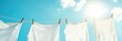 © Анатолий Сав - Bright white clothes drying in the sun on a line under a clear blue sky with copy space for text. Generative AI