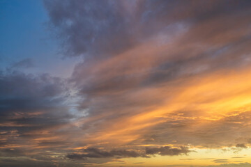 Wall Mural - glowing real sky at sunset texture background overlay. dramatic red and orange clouds.