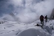 © Iwona - Winter mountain panorama with climbing trekkers during route to Renjo La Pass. Sagarmatha National Park, Himalayas, Nepal