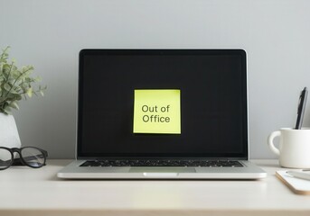 Out of office message displayed on laptop screen, indicating worker absence