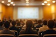 © Imagentive - Blurry Large Conference Audience Watching Presentation