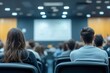 © Imagentive - People Sitting in Lecture Hall Presentation Blurred Background