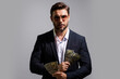 © Volodymyr - Business man with money banknotes. Male entrepreneur with dollar bills. Lucky boss, insurance agent, manager. Freelancer with cash. Mock up, for white banner with copy space.