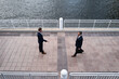 © Volodymyr - Two successful business people colleagues in formal suit handshaking on outdoor meeting. Hands of businessmen shaking after agreement on meeting. Business team handshake. Welcome deal.