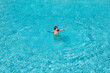 © Volodymyr - Child splashing in summer water pool. Kid splash in pool. Excited happy little boy jumping in pool, water fun. Kid jumping in the swimming pool and splashing water. Kid splashing on poolside.