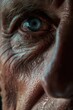 © vefimov - Old man with blue eyes and wrinkled skin looking into the distance.