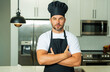 © Volodymyr - Man chef cooker baker. Millennial male chef in chefs uniform. Chef man cooking on kitchen. Chef cook in hat and apron.