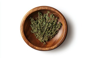 Sticker - Dried thyme leaves in a wooden bowl isolated on white Flat lay view Ground thyme seasoning