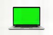 © Maryna - Modern laptop computer with blank green screen on white background. Portable device with silver aluminum body. Empty display ready for graphics video overlay. Versatile product for mockups digital