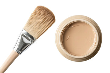 A makeup brush and a jar of cream sit on a white background