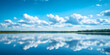 © AI Images - Serene lake landscape with blue sky and cloud reflections in calm water : Generative AI