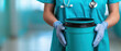 © Wonderful Studio - A healthcare professional in scrubs holds a teal container, emphasizing cleanliness and safety in a clinical environment.