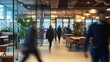 © adri - Blurred motion of people walking in a modern office.
