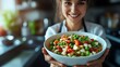 © Marifatul - Woman Holding Bowl Of Delicious Vegetable Salad