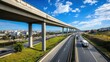 Highway Overpass with City Skyline and Blue Sky