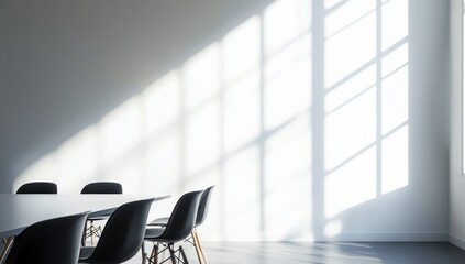 Wall Mural - Sunlight streams into a minimalist room with a white table and black chairs.