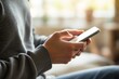 © PlanetOfVectors - A person holding a smartphone with both hands, wearing a long-sleeve shirt, blurred indoor background, casual concept, Ai generative