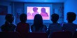 © Pech - A group of students watching a tutorial video on a projector during a learning session at school or college.