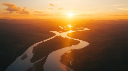 Canvas Print - Aerial view of a meandering river at sunset.