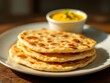 © zerostudio.id - Golden-Brown Naan Bread Stack: A Warm and Rustic Culinary Image