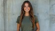 © CStock - Cheerful modern woman in an olive T-shirt, smiling casually with hands in her pockets against an urban backdrop, on solid white background, single object