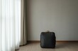 © fabioderby - Modern suitcase resting in minimalist room by sunlit curtain