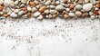 © FairValue Stock - Collection of small pebbles spread across a white surface