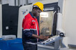 © SpaceOak - Skilled Worker Operating Advanced Machinery in a Manufacturing Facility