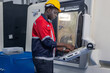 © SpaceOak - Skilled Worker Operating Advanced Machinery in a Manufacturing Facility